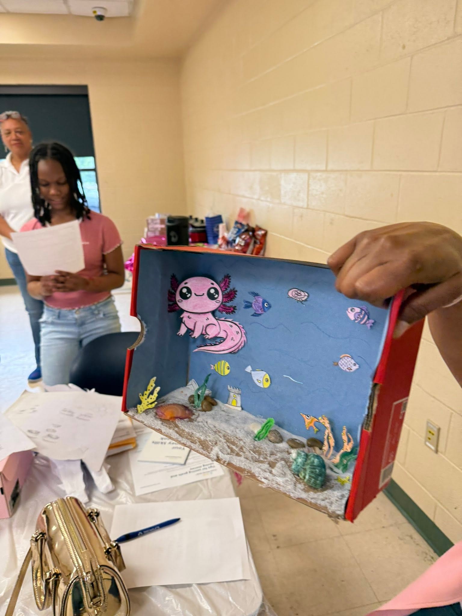 Mentor leading a money-skills workshop